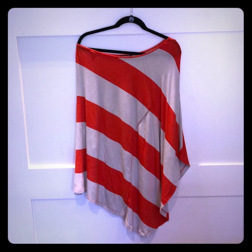 Off shoulder fitted dress with winged arm.